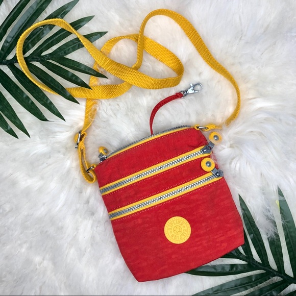 Kipling Handbags - Kipling small yellow and orange crossbody